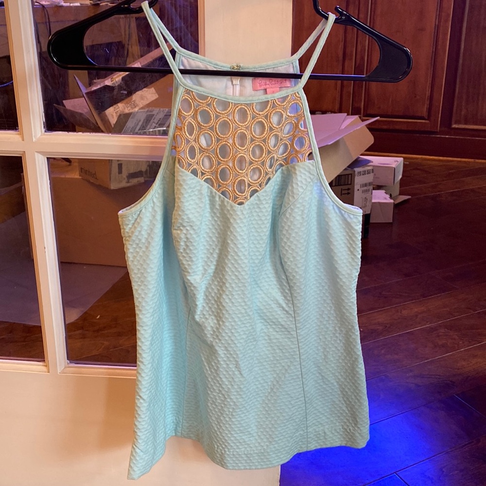 Lilly Pulitzer sleeveless aqua top with metallic cutouts, size 2
